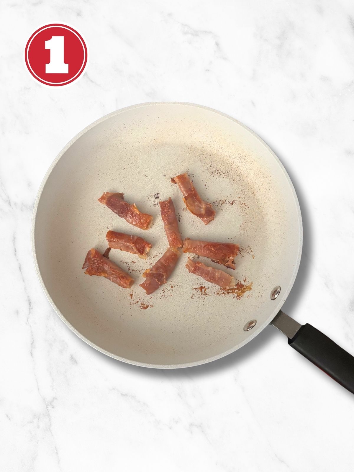 rolled prosciutto in a fry pan crisped