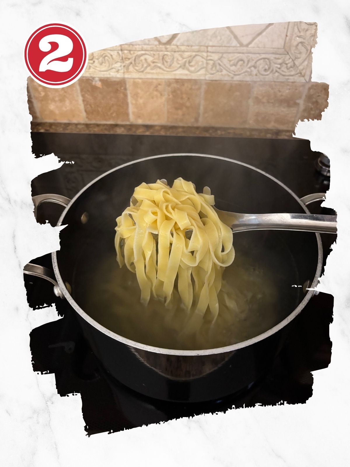 pappardelle pasta cooked coming out of pot of water