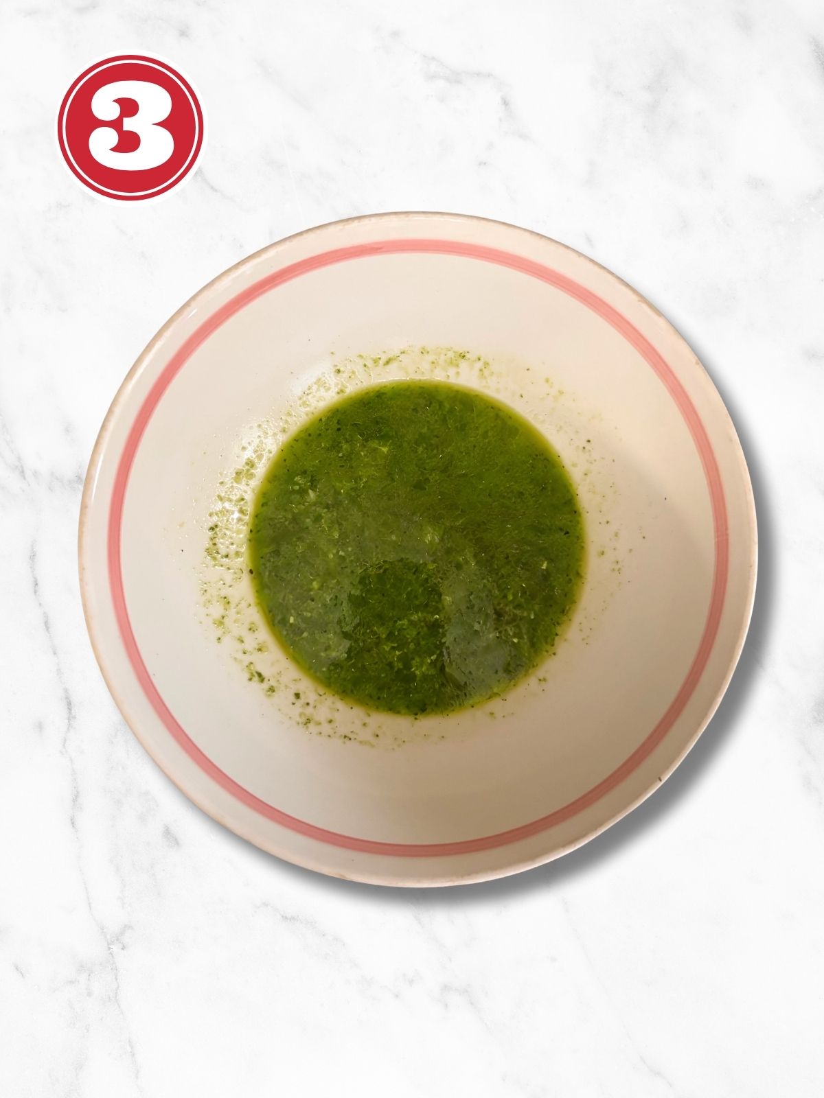 pesto in a bowl with pasta water