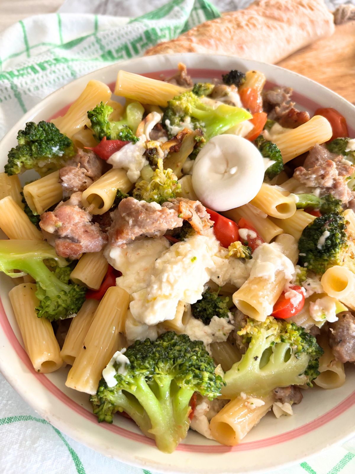 Burrata Pasta with broccoli and sausage in a bowl