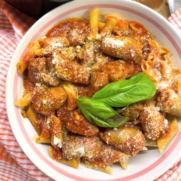 Penne Pasta with Sunday Sauce in a white bowl
