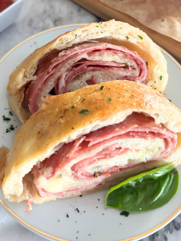stromboli slices on a white plate Featured Image