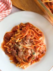 baked spaghetti in a clear baking dish FI