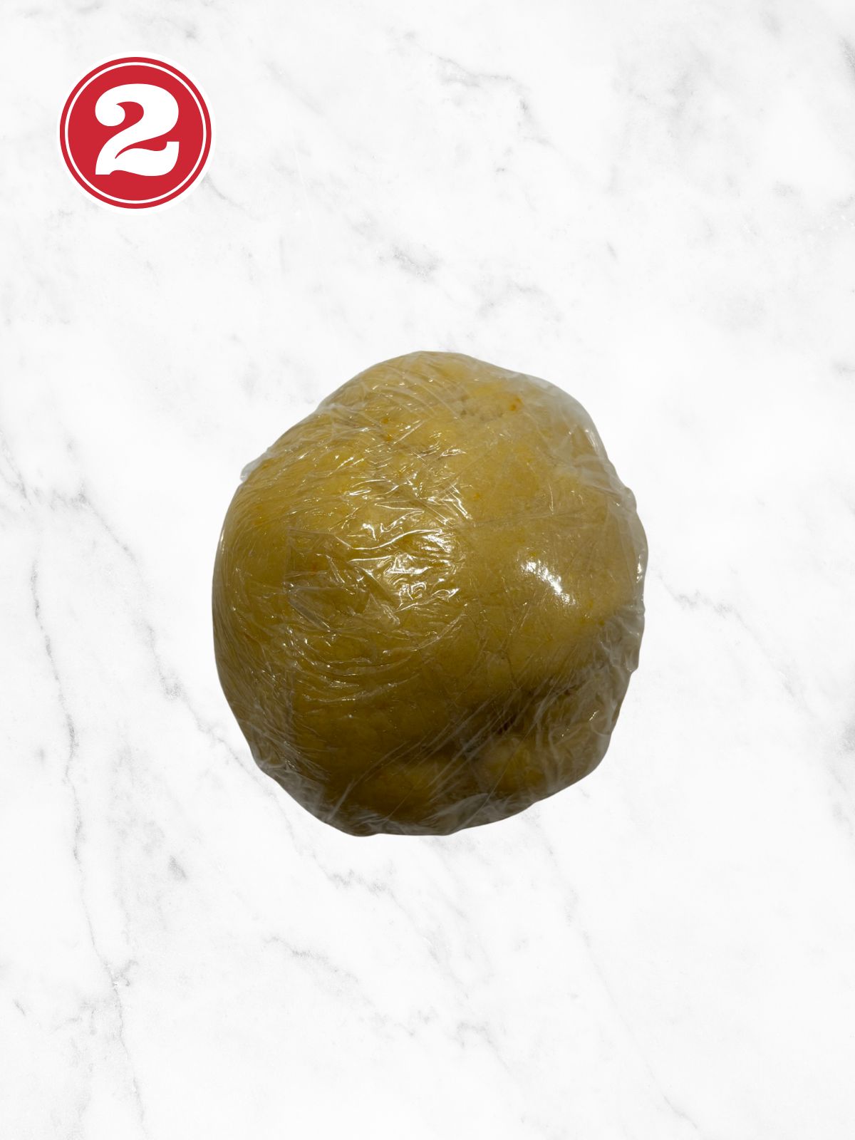 pastry dough in plastic wrap