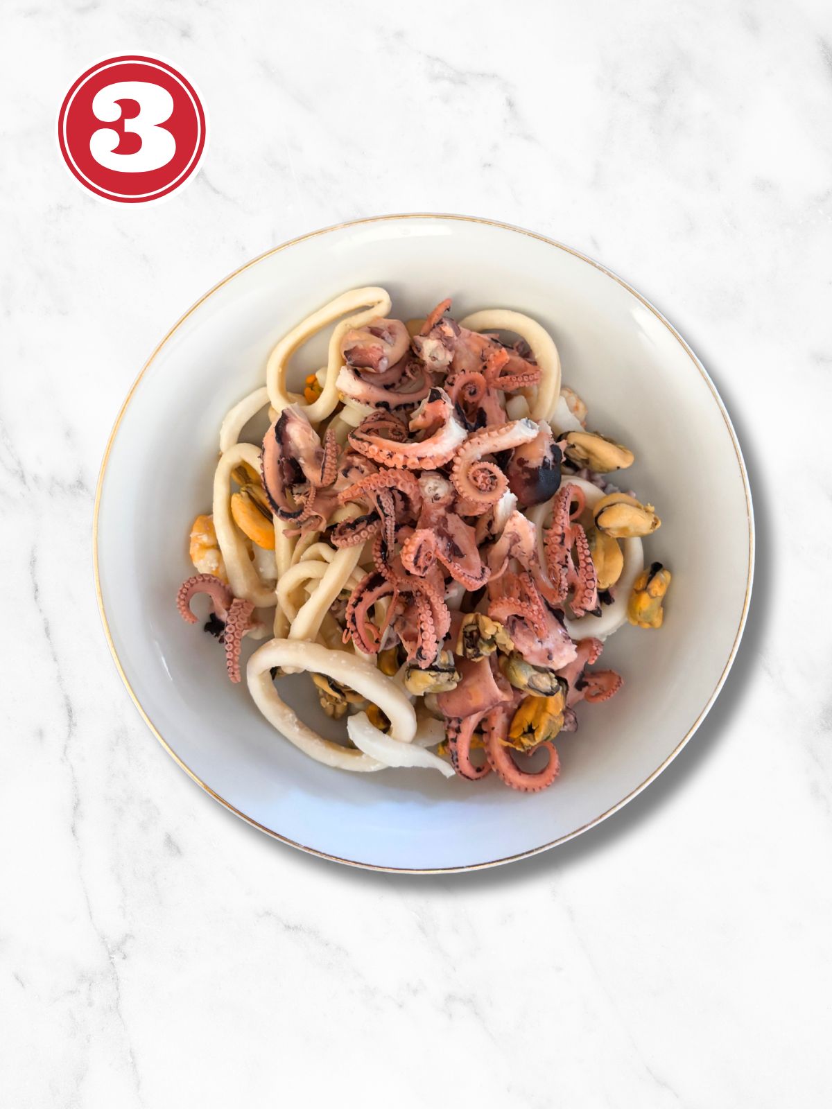 cooked seafood in a white plate