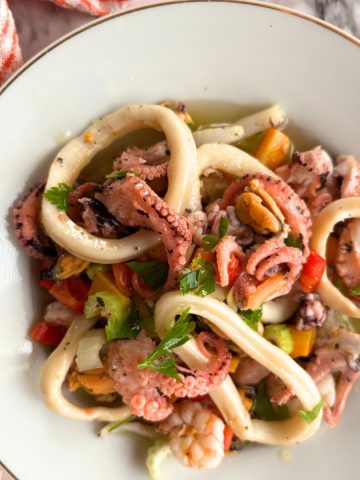 seafood salad in a white plate